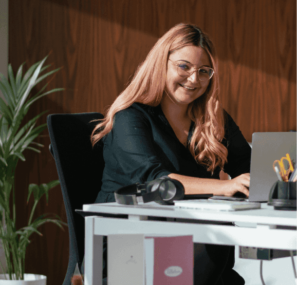 Two people working on a laptop