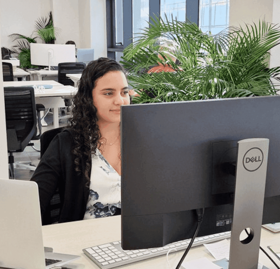 Man looking on his desktop screen with charts