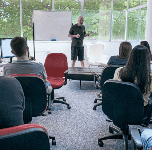 Man teaching a group of people